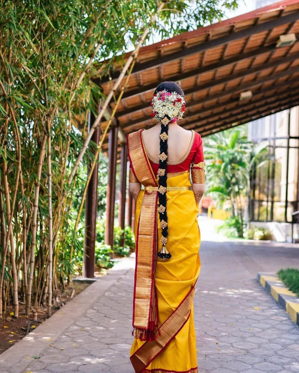 Ruby and Emerald Encrusted Kerala Bridal Hairstyle Backside