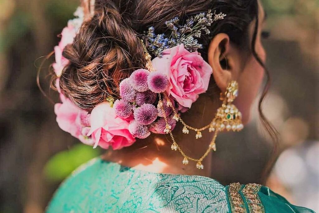 Bun hairstyle with flower arrangement Archives | Threads - WeRIndia